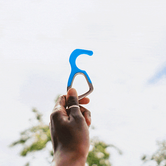 Patented antimicrobial silicone no-touch keychain tool on a white background